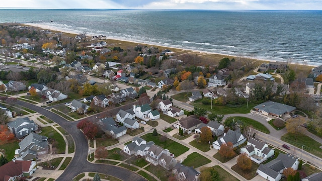 aerial view with a water view and a view of the beach