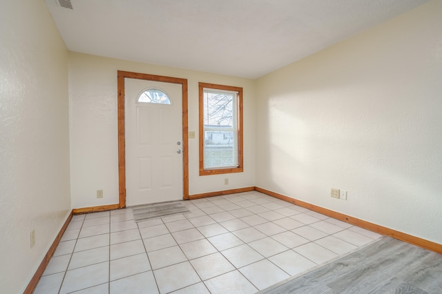 entryway featuring light tile patterned floors