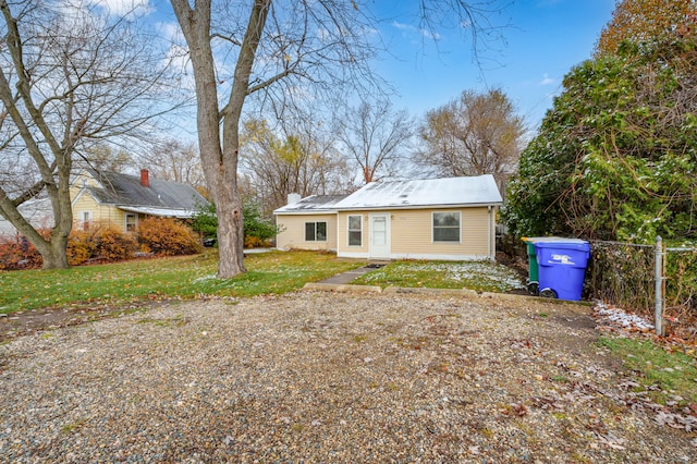 back of house featuring a yard