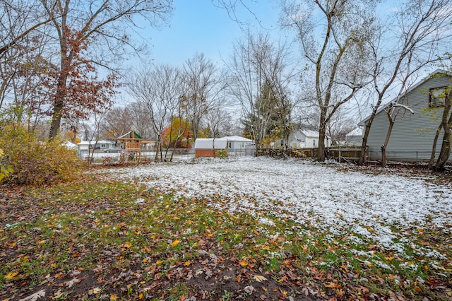 view of yard layered in snow