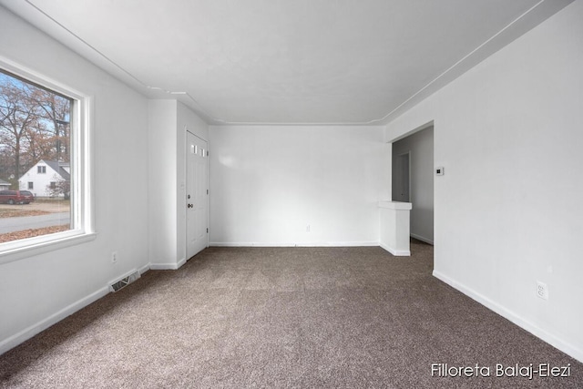 4481 Marshall Ave SE, Grand Rapids, MI 49508 - spare room featuring carpet and baseboards