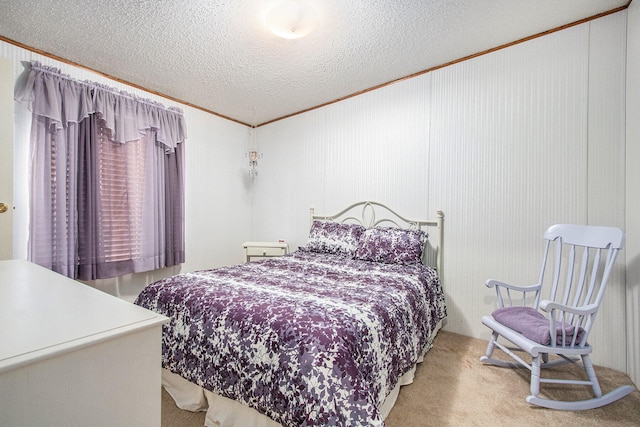 carpeted bedroom featuring a textured ceiling and crown molding