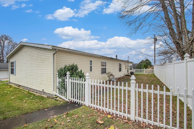 view of home's exterior featuring a lawn