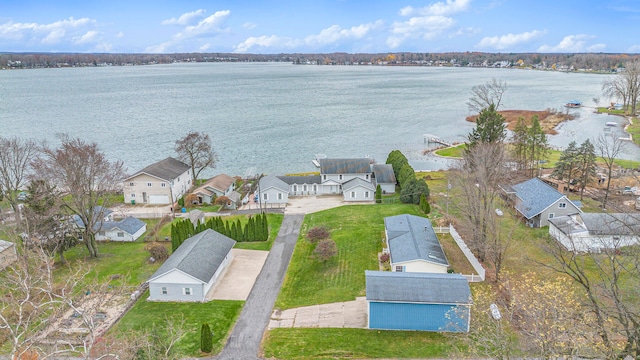 birds eye view of property with a water view