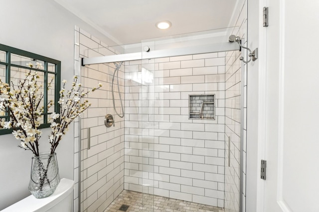 bathroom with walk in shower, tile patterned floors, and toilet