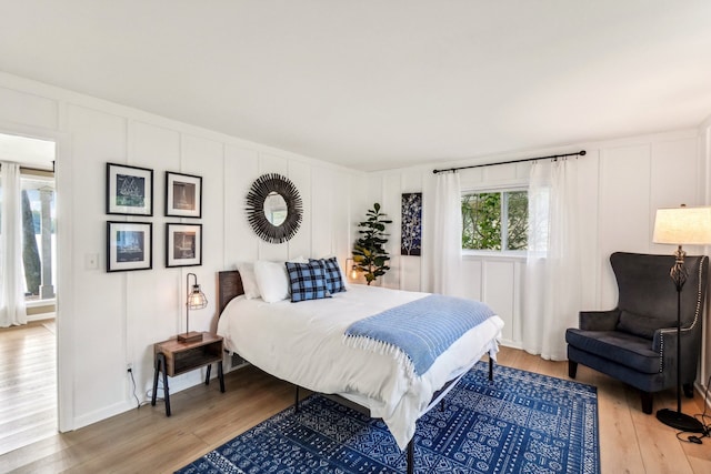 bedroom with hardwood / wood-style flooring