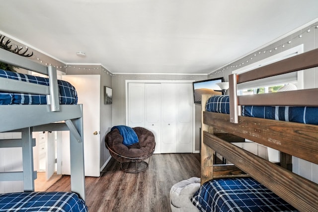 bedroom featuring hardwood / wood-style flooring and a closet