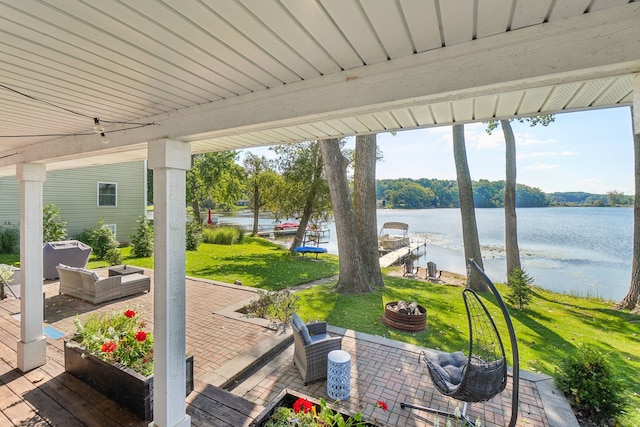 view of patio / terrace with an outdoor hangout area and a water view