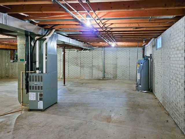 basement with gas water heater and heating unit