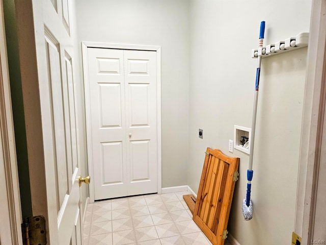 laundry room with hookup for a washing machine, light tile patterned floors, and hookup for an electric dryer