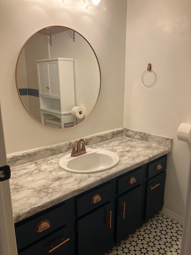 bathroom with tile patterned floors and vanity