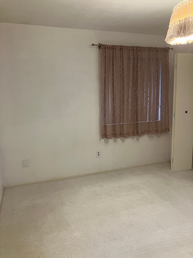 empty room featuring carpet flooring