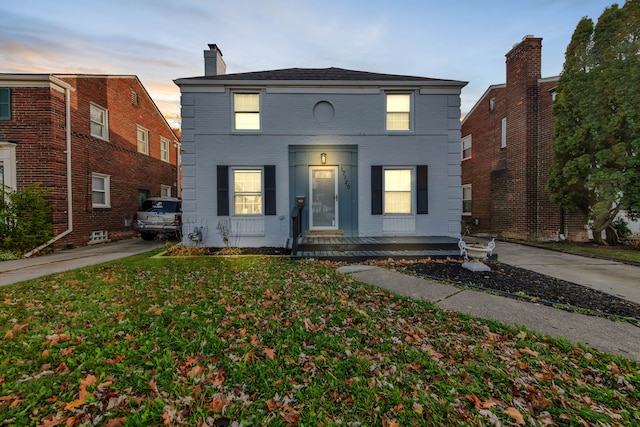 view of front of home with a lawn