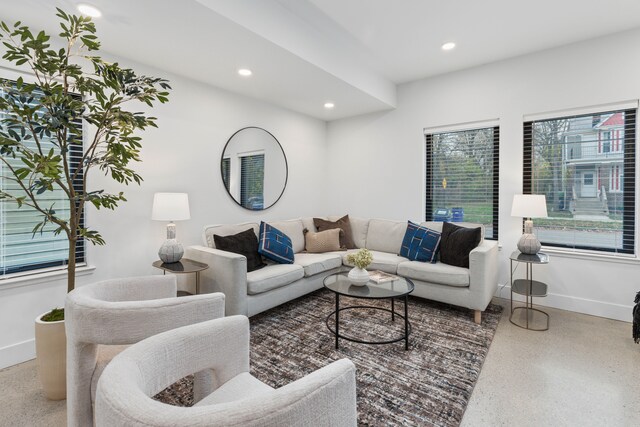 1636 Merrick St Unit 8, Detroit, MI 48208 - living room with speckle patterned floor, baseboards, and recessed lighting