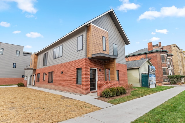 1636 Merrick St Unit 8, Detroit, MI 48208 - view of front facade featuring brick siding and a front yard