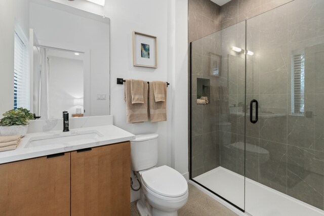 1636 Merrick St Unit 8, Detroit, MI 48208 - bathroom with toilet, vanity, and a shower stall