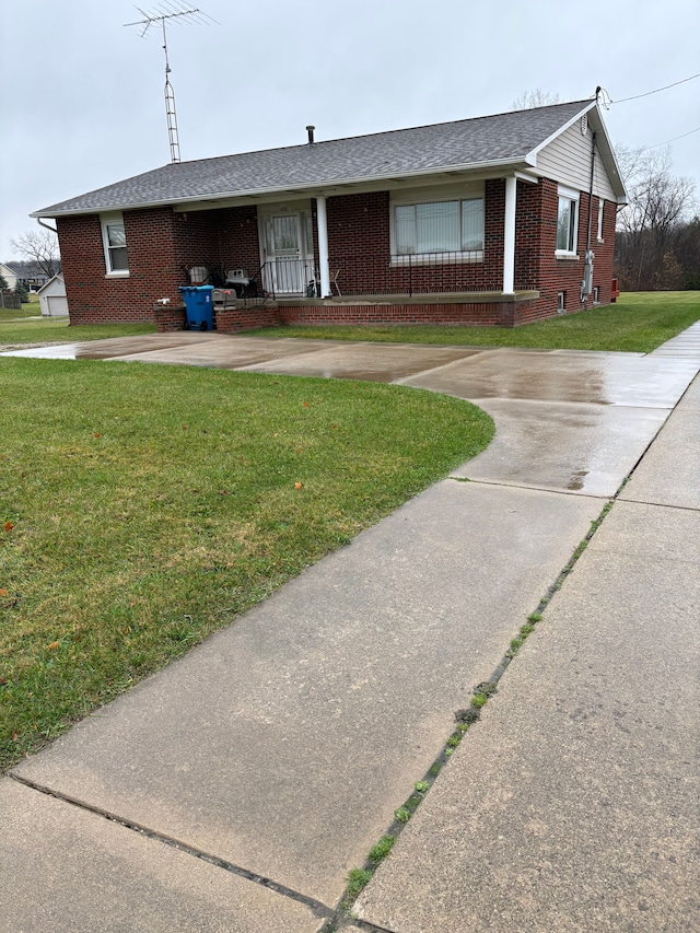 single story home with a front yard and a porch