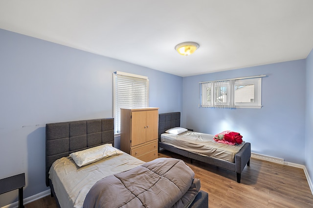 bedroom with hardwood / wood-style flooring