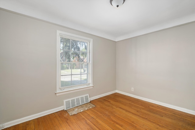 empty room with wood-type flooring