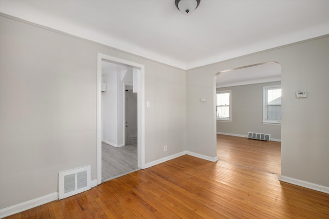 spare room with hardwood / wood-style floors