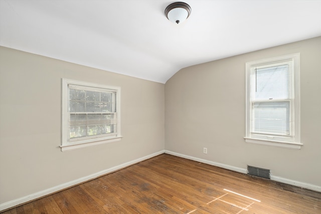 bonus room featuring hardwood / wood-style flooring and vaulted ceiling