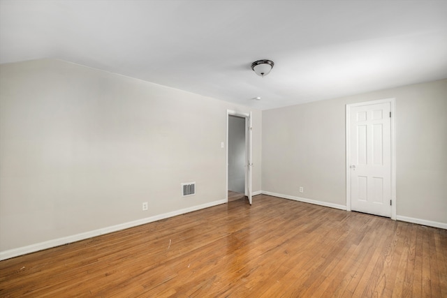 empty room featuring hardwood / wood-style flooring