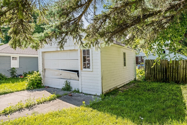 exterior space featuring a garage and an outdoor structure