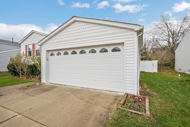 garage with a lawn