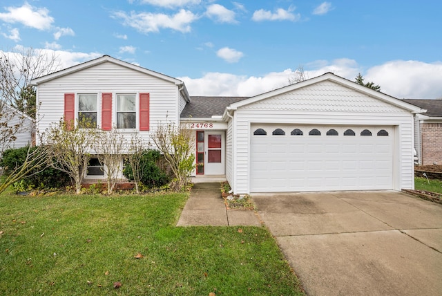 view of front facade with a garage and a front yard