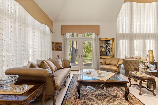 living area with french doors and lofted ceiling