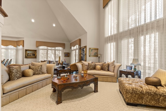 living room with high vaulted ceiling