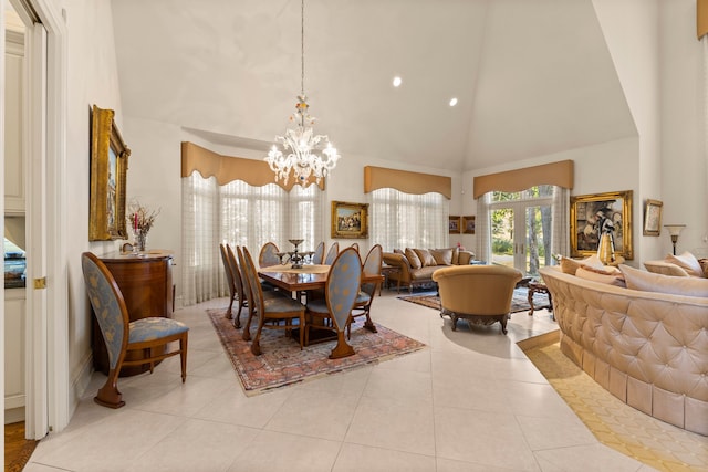 dining space with light tile patterned floors, high vaulted ceiling, and a notable chandelier