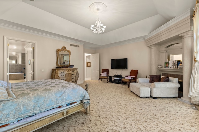 carpeted bedroom featuring a raised ceiling, ornamental molding, connected bathroom, and an inviting chandelier