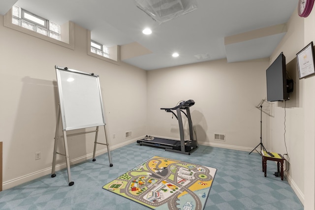 exercise area featuring carpet floors