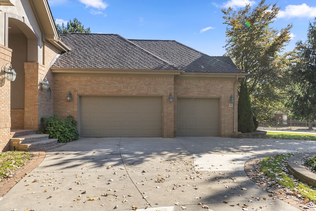 view of side of property with a garage