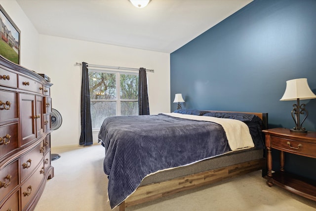 bedroom featuring light colored carpet