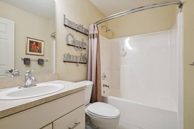 bathroom featuring toilet, shower / tub combo with curtain, and vanity