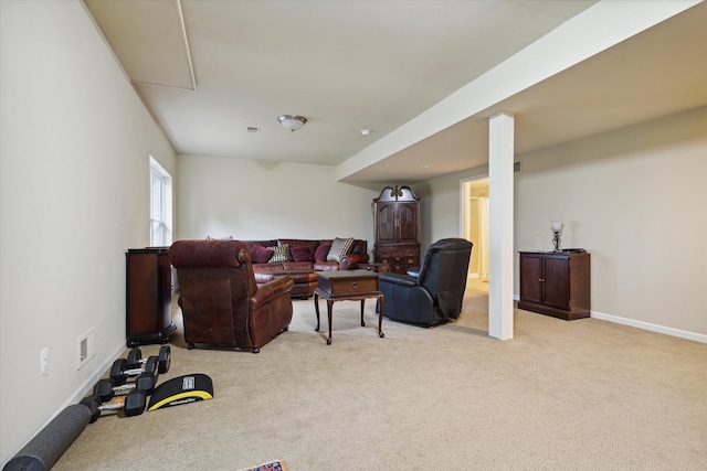 living area with light carpet, visible vents, and baseboards