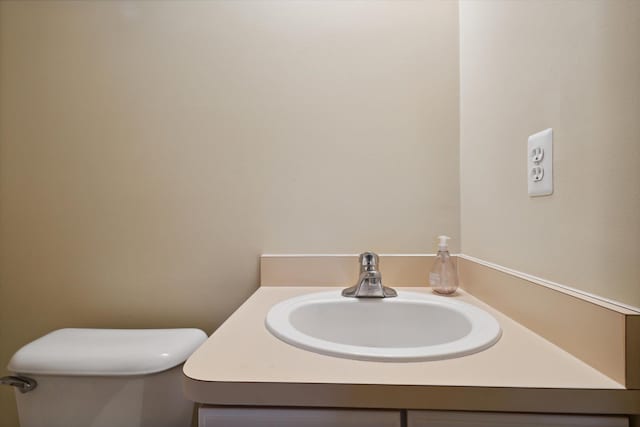 half bath with toilet and vanity