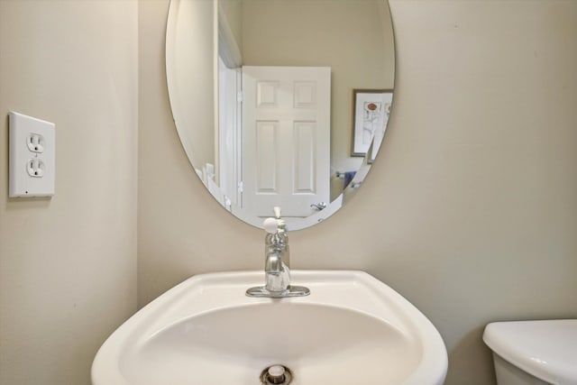 bathroom featuring a sink and toilet