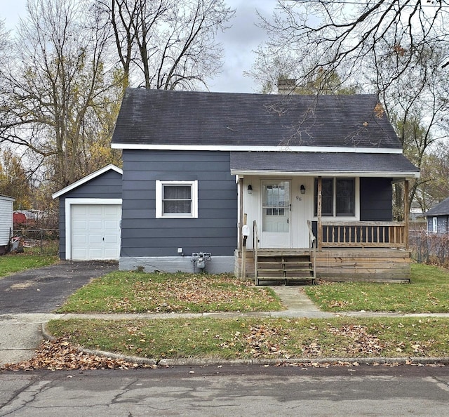 view of front of property featuring a garage and covered porch