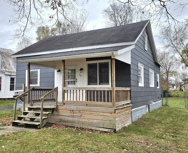 view of front of property with a porch and a front yard