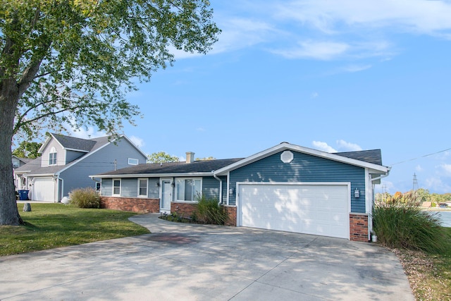 ranch-style house with a garage and a front lawn