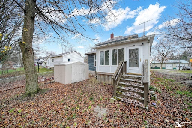 back of property with a shed