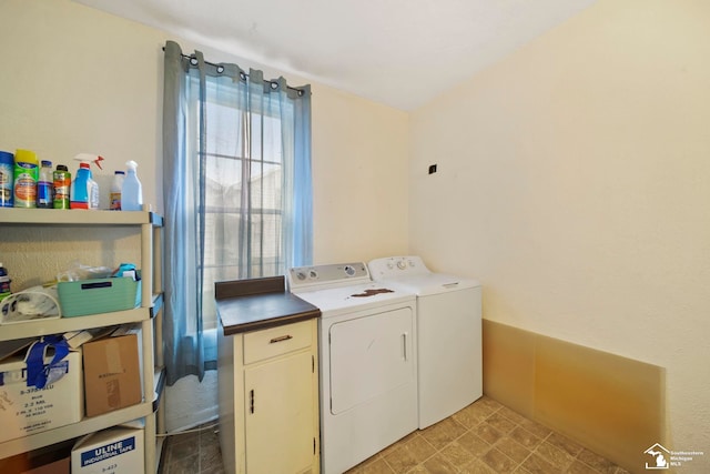 washroom featuring washer and clothes dryer