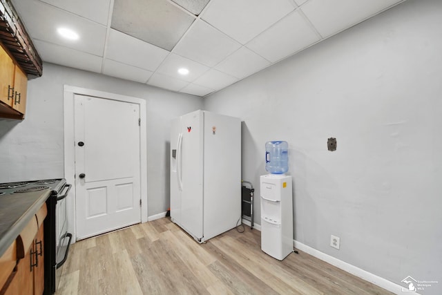 laundry room with light wood-type flooring