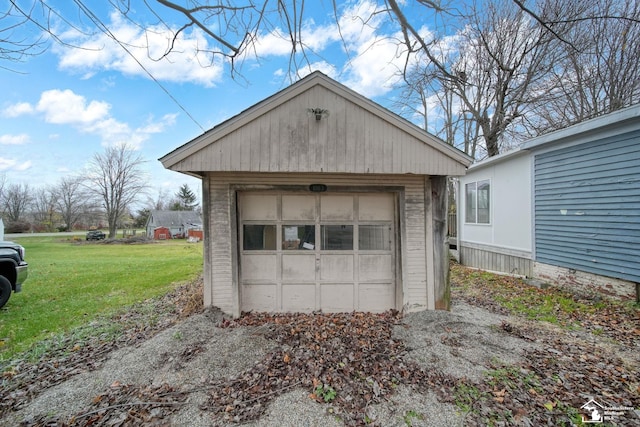 garage featuring a lawn