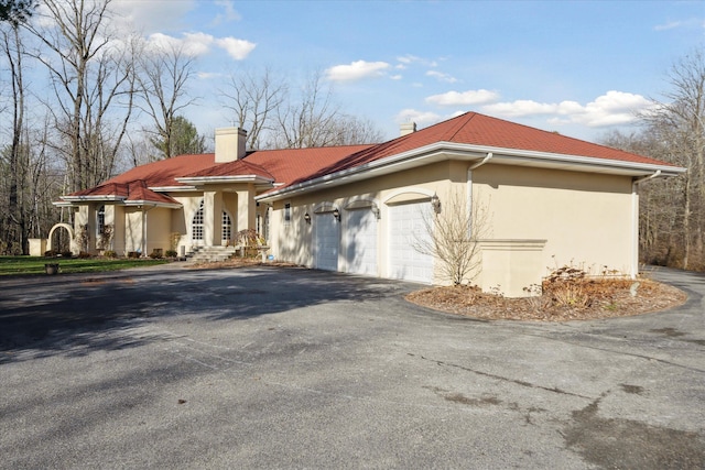 view of side of property featuring a garage