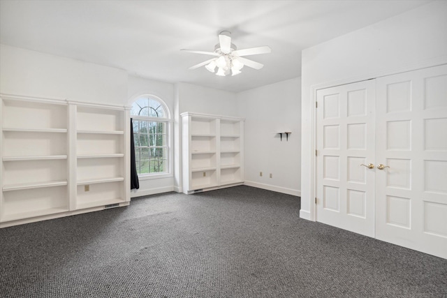 interior space with ceiling fan