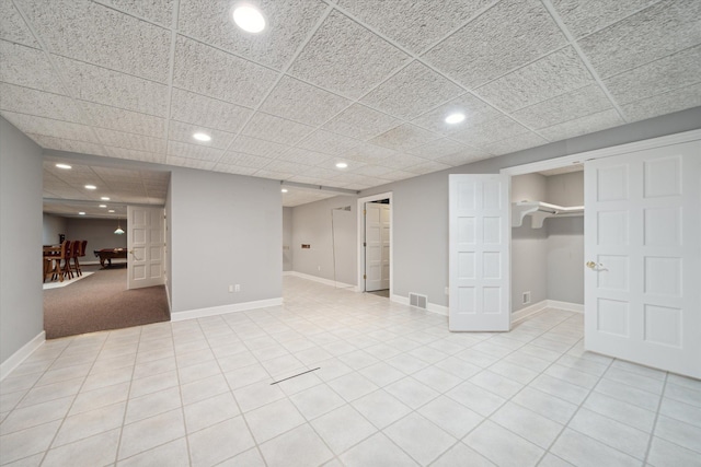 basement with light tile patterned flooring